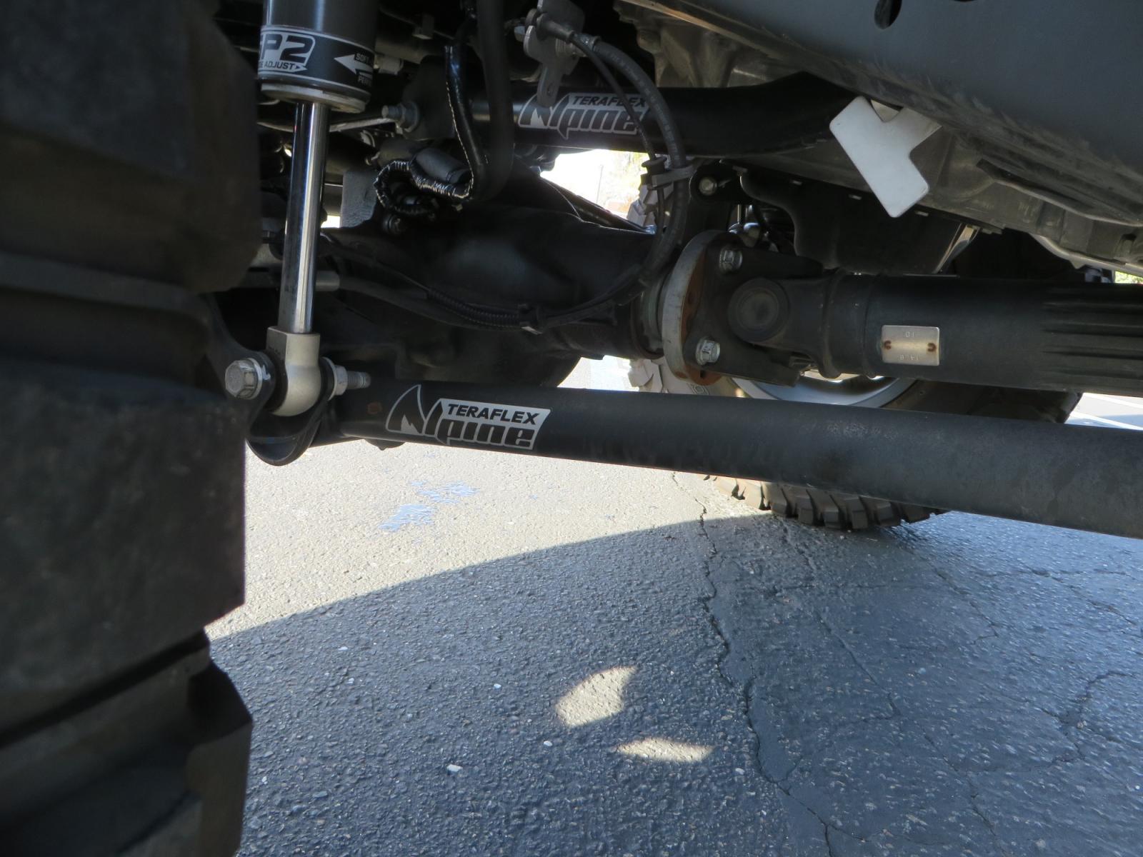 2018 BLACK /BLACK Jeep Wrangler JL Unlimited Rubicon (1C4HJXFG0JW) with an 3.6L V6 DOHC 24V engine, automatic transmission, located at 2630 Grass Valley Highway, Auburn, CA, 95603, (530) 508-5100, 38.937893, -121.095482 - JL Rubicon sitting on Teralfex suspension, Falken fast adjust shocks, Method wheels, BFG KM3 tires, Smittybilt winch, Rigid Leds, window tint, RC Fender eliminators, DV8 rear bumper, Smittybilt HD hinge kit, and a terflex spare tire relocation. - Photo #12
